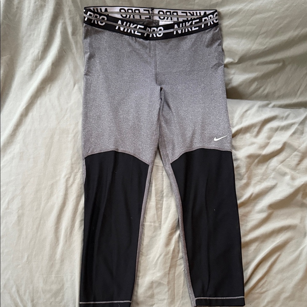 Nike Pro Dri-Fit Gray and Black Leggings with mesh accent.
